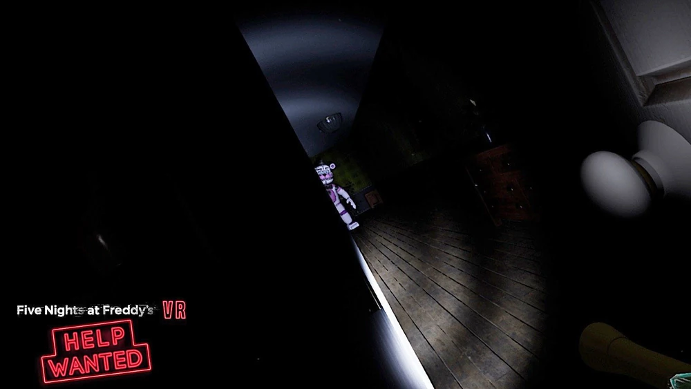 Funtime Freddy standing at the end of a hall