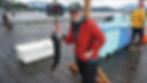 Shannon Whistler poses with a fish at the Auke Nu Weigh Station on Sunday, Aug. 10, 2025. (Ellie Ruel / Juneau Independent)
