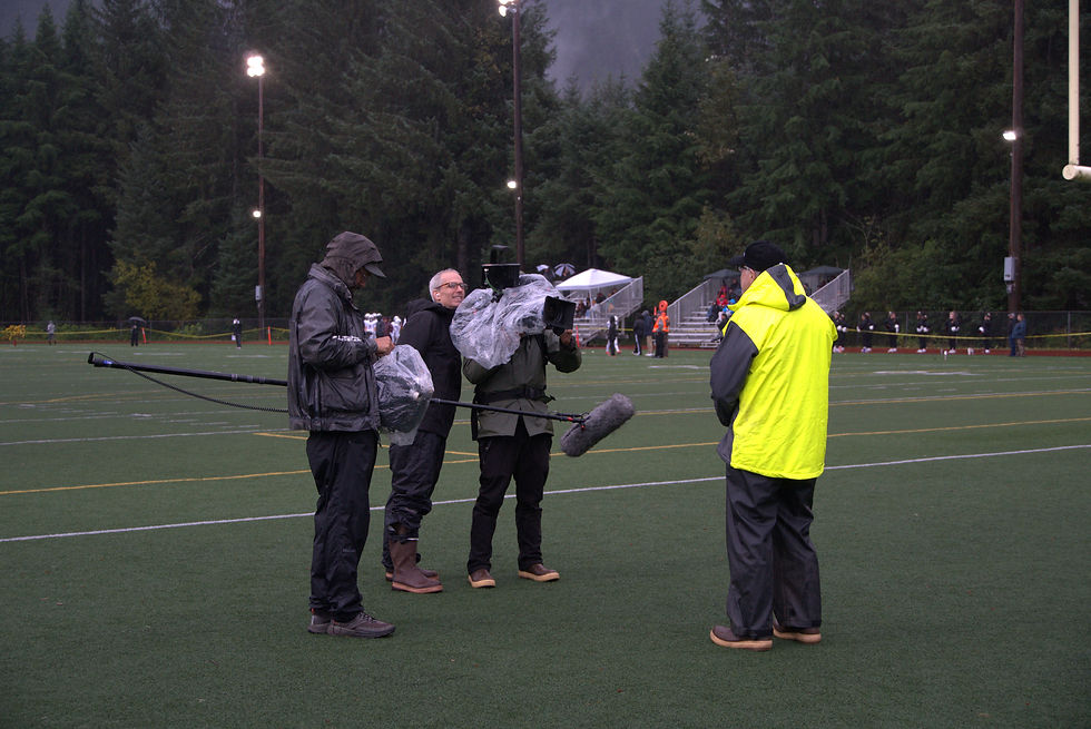 An NBC Sports film crew tapes Peter King talking about Thunder Mountain during the Crimson Bears' football game against Dimond High School on Saturday, Sept. 20, 2025, at Adair-Kennedy Memorial Field. (Ellie Ruel / Juneau Independent)