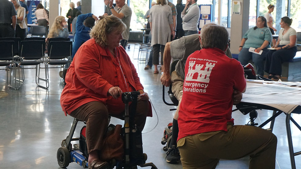 Debbie Penrose-Fischer speaks with U.S. Army Corps of Engineers representatives in the Thunder Mountain Middle School Commons on Tuesday, July 9, 2026. (Ellie Ruel / Juneau Independent)