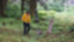 Jamiann S’éiltin Hasselquist weedwhacks a section of the Lawson Creek cemeteries on June 27, 2026. (Ellie Ruel / Juneau Independent)
