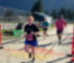 Heidi Hall crosses the finish line of the Beat the Odds 5K route at Kax̲dig̲oowu Héen Elementary School on Saturday, Aug. 23, 2025. (Photo courtesy of Kym Mauseth)