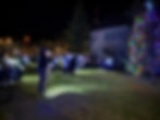 People sing carols at the annual Douglas Christmas Tree Lighting in the Douglas Community United Methodist Church courtyard on Friday, Nov. 28, 2025. (Ellie Ruel / Juneau Independent)