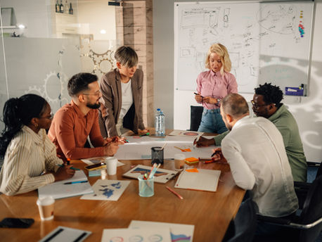 Marketing professionals collaborating on project in modern office