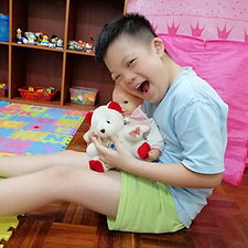 Child playing with toys during play therapy session