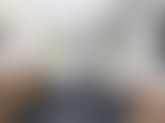 Modern bathroom remodel with freestanding tub, walk-in shower, and wood cabinetry in a bright Portland home.