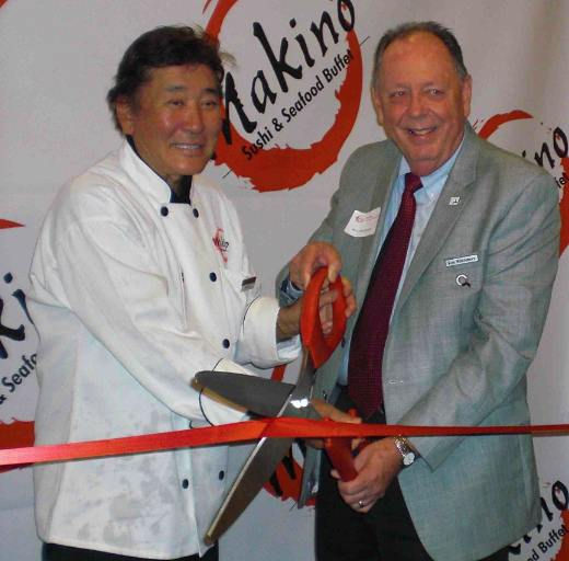 Ribbon-cutting by owner Kaku Makino and Ron Whittemore of the Industry Manufacturers Council.