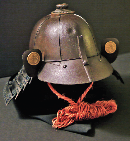 A samurai helmet by Myochin Masuda Sadakatsu bearing three bullet test indentations.