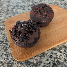 Indulge in the ultimate dairy-free delight with our Death by Chocolate cupcake featuring a special chocolate sandwich cookie and chocolate chip topping on top of a rich and fluffy cupcake. This decadent treat brings together layers of intense chocolate flavor that everyone can enjoy. Perfect for those seeking accessible, dairy-free baked goods without compromising on taste or texture. Each bite is a celebration of rich chocolate happiness, topped with irresistible crunch and sweetness. Experience how inclusive baking can be truly delicious with every mouthwatering cupcake.