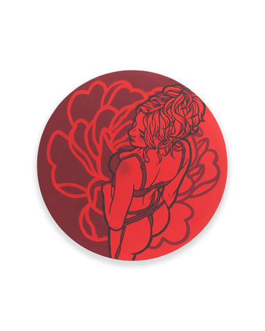 Circular artwork with a detailed red floral pattern