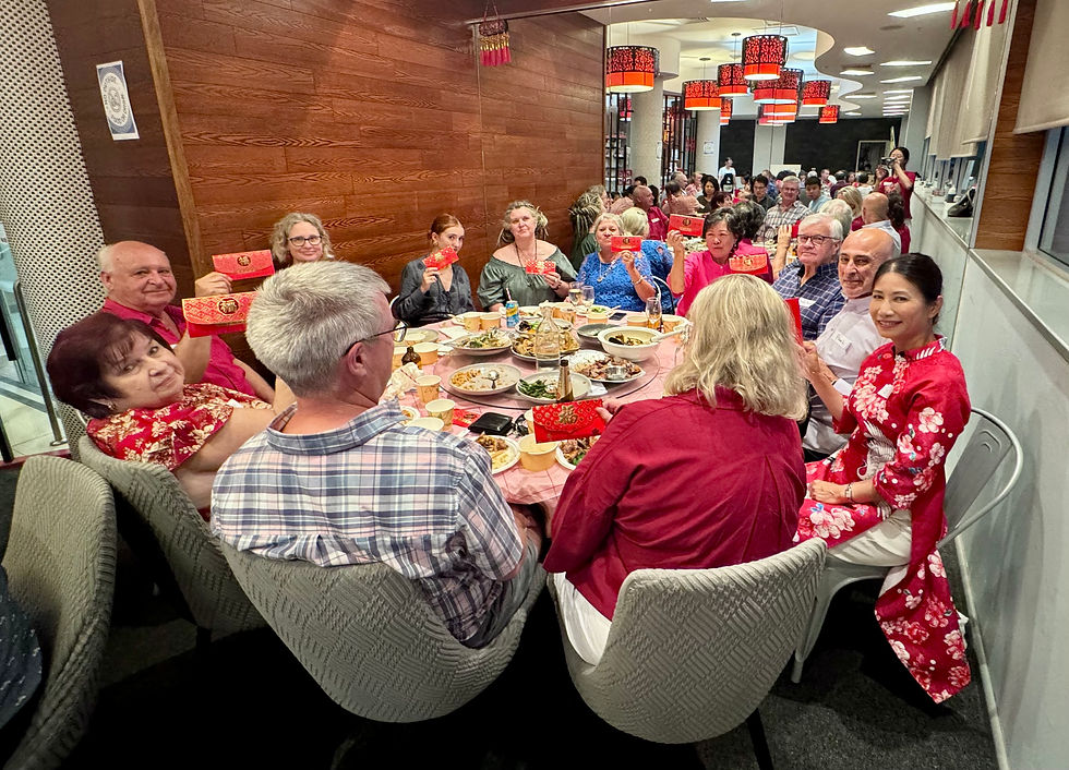 Diners showing off their red packets during Lunar New Year Dinner at 27 Palace