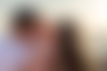Parrents kissing thier cute baby family photograph