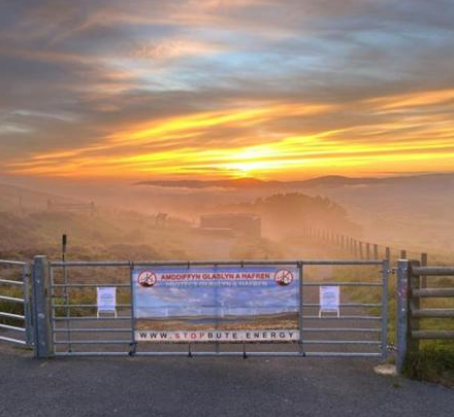 Banner protesting Powys windfarms stolen from viewpoint