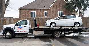 It's a picture of ABC's Tow Truck and towed car