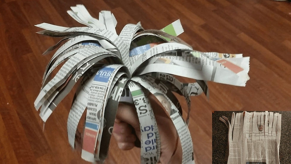 newspaper pom pom