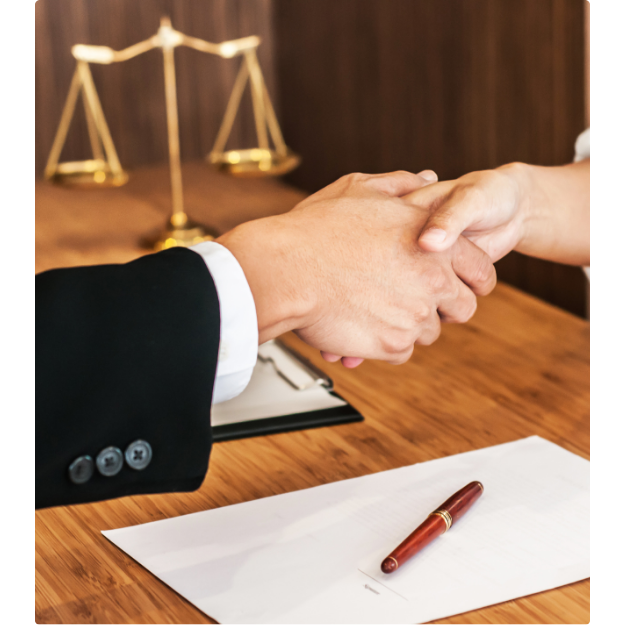 lawyer and client sharing a handshake