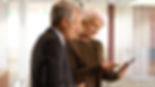 senior citizens reviewing financial information on a smart phone in Ottawa