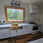 Country Kitchen with Gold Finishes and White Subway Backsplash