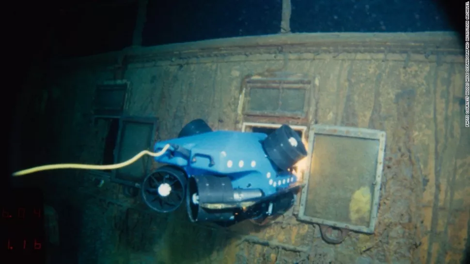 Underwater robot inspecting a shipwreck