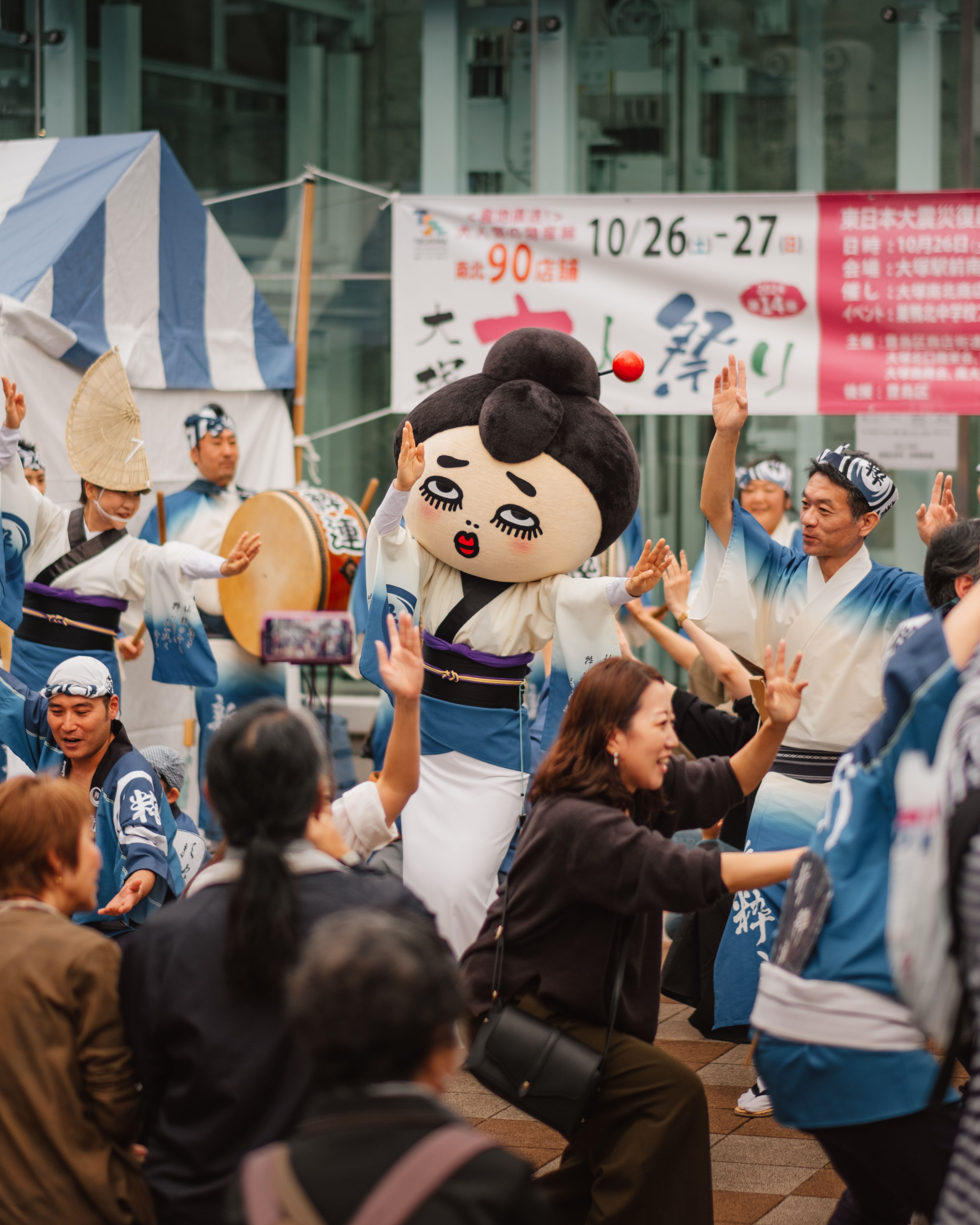 Dancers and spectators taking part in a Japanese street festival