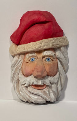 santa woodcarving, carved from basswood and painted with acrylics.  Available for purchase