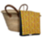Yellow wild flowers waterproof picnic blanket folded beside a woven basket, showing vibrant floral cotton print.