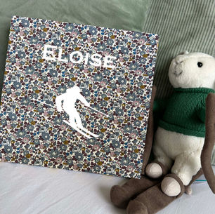 Eloise personalised ski medal holder with red floral Indiana pattern by Petiotes London.