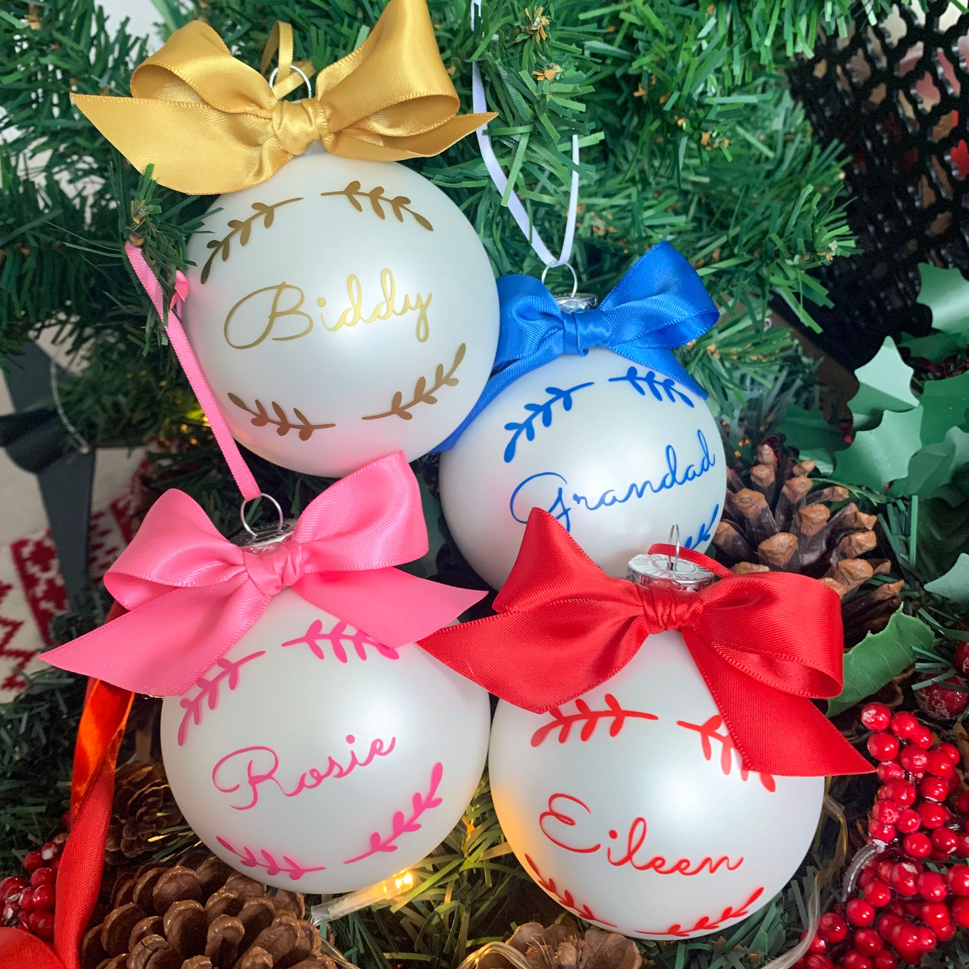 Personalised glass Christmas baubles with family names — Wreath collection in cream and pastel by Petiotes London