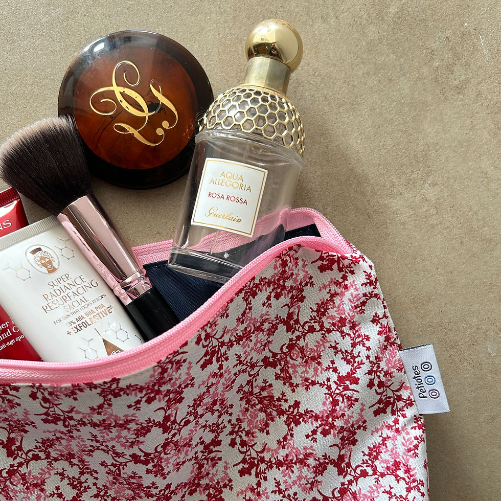Personalised pink floral wash bag with gold initials and makeup — handcrafted by Petiotes London