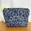 Thumbnail: Indigo Fern wash bag with waterproof lining and neon yellow zip, featuring navy botanical print – compact and travel-ready