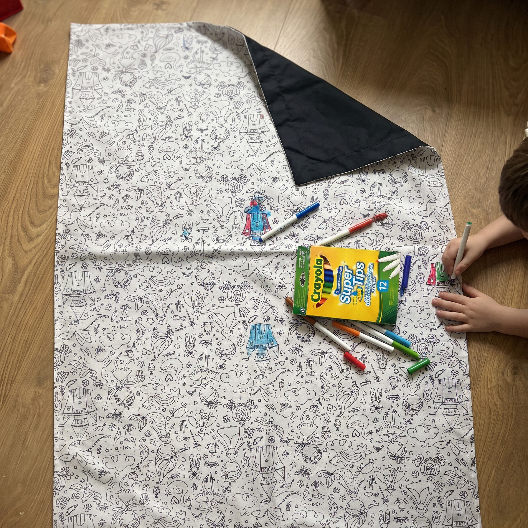 Child colouring the mermaid small colouring blanket for girls with washable pens, navy waterproof backing turned up