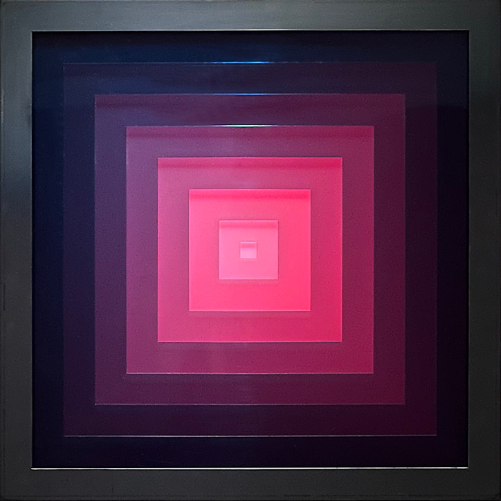 Square abstract light-object in which seven acrylic sheets are layered and chosen interactive light is pink.