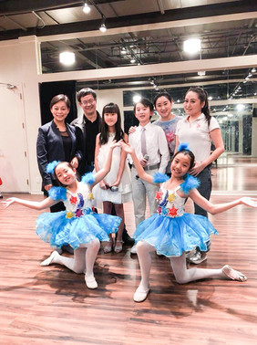 Prima Academy students performing a choreographed routine on stage