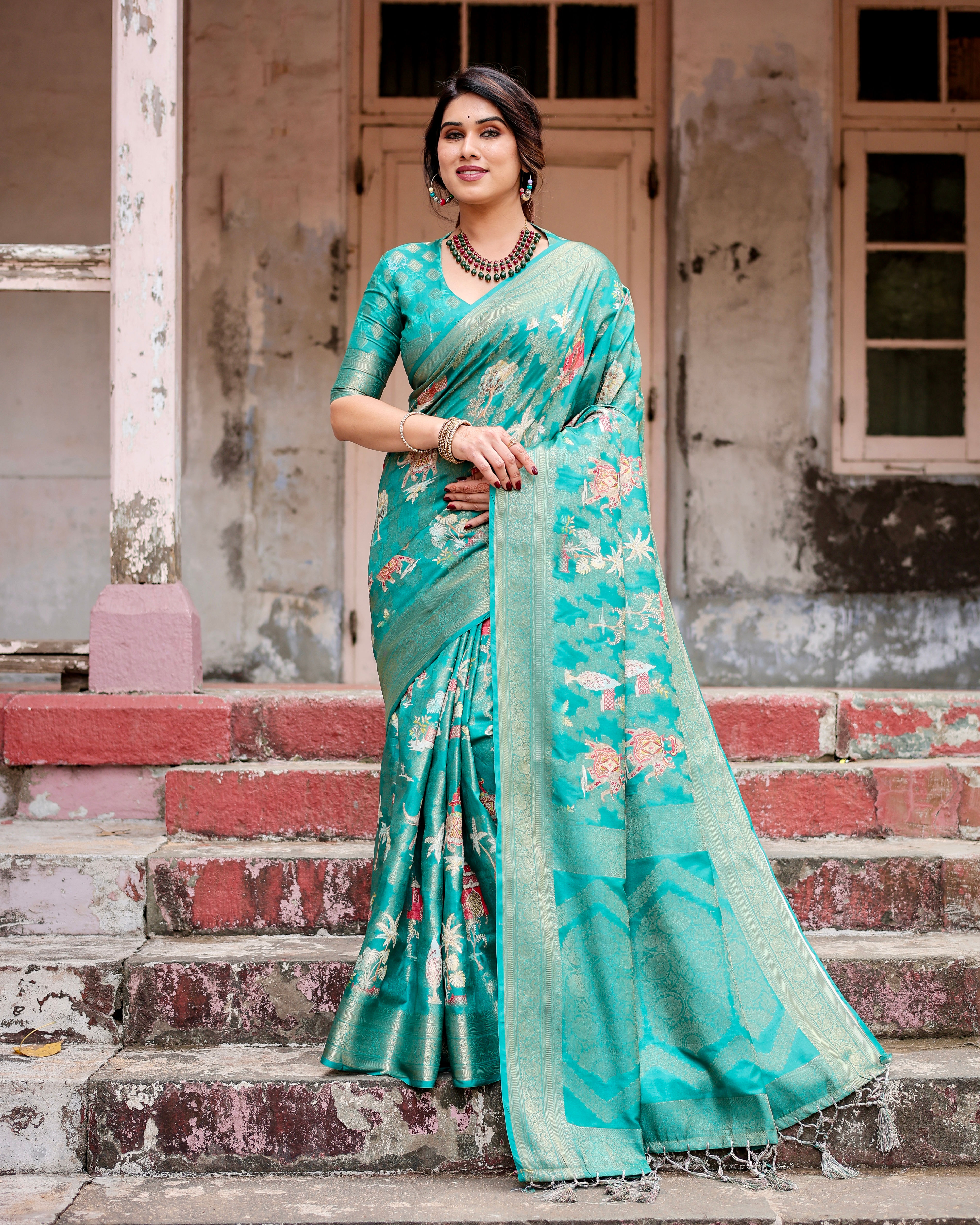 Elegant aqua green Banarasi silk saree with golden zari work, perfect for weddings and festive occasions