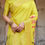Thumbnail: Full view of Yellow Silk Saree with detailed Rajasthani art print pallu, perfect for festive or Haldi events.