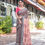Thumbnail: Woman in a gorgeous charcoal and peach linen saree with contrasting geometric and floral block prints