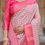 Thumbnail: Close-up of Tussar Silk Saree showing the white/pink check pattern and heavy hot pink zari woven border.