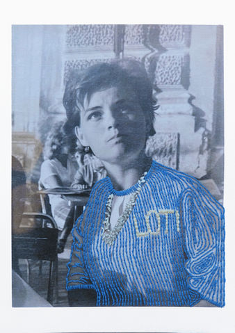 Embroidered sweater with Loti label on black and white photograph