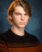 professional acting headshot of a young man, blonde hair, dramatic expression for film shots.