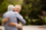 medium-shot-man-woman-hugging-outdoors.jpg