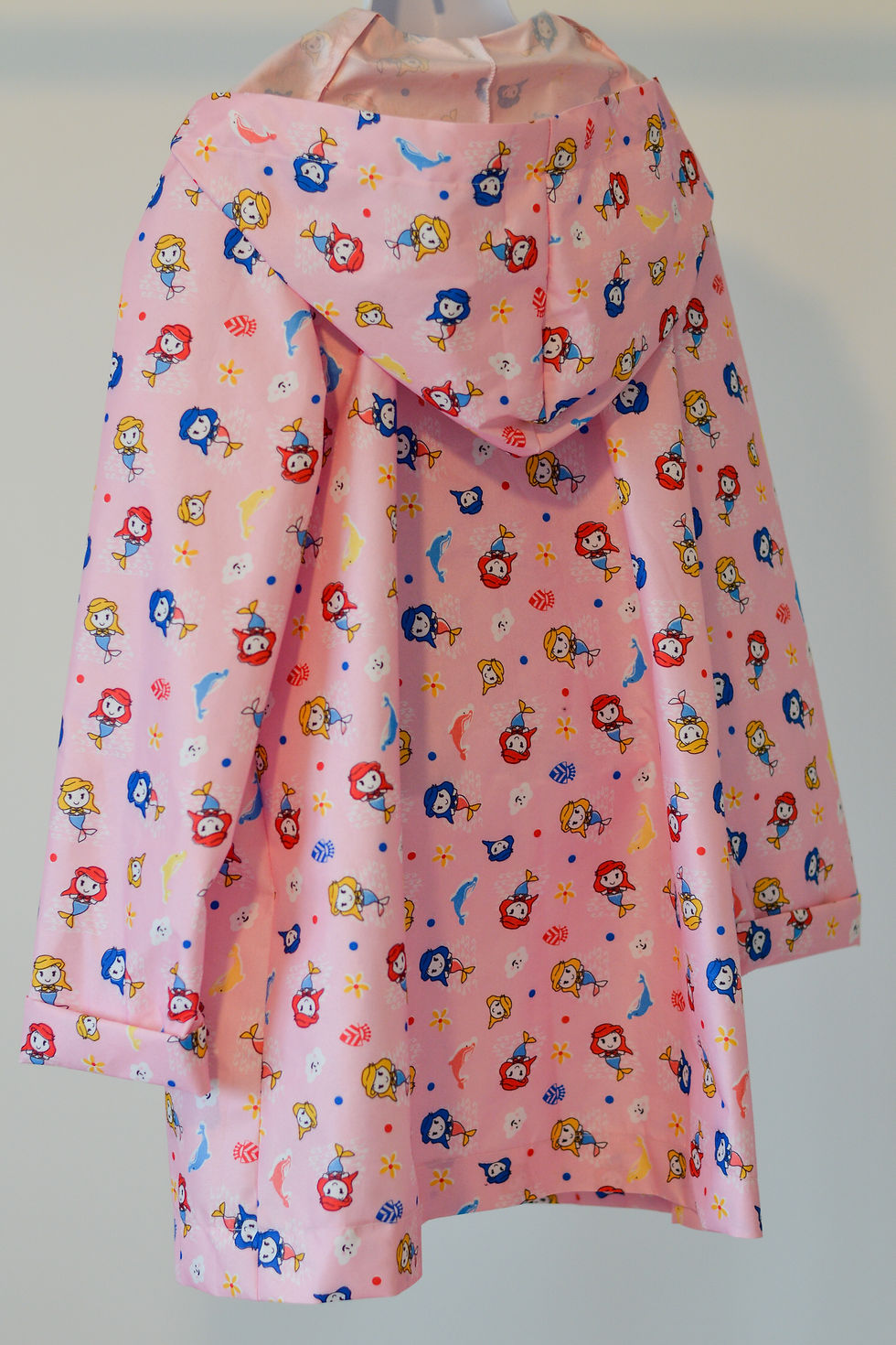 Thumbnail: An Olivia Inspirations Raincoat with mermaid pattern back view.