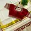 Thumbnail: Maroon tussel tissue saree with readymade blouse closeup view