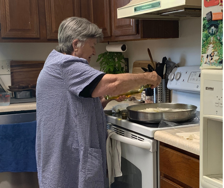 My Greek grandmother making spinach pie, also known as spanakopita