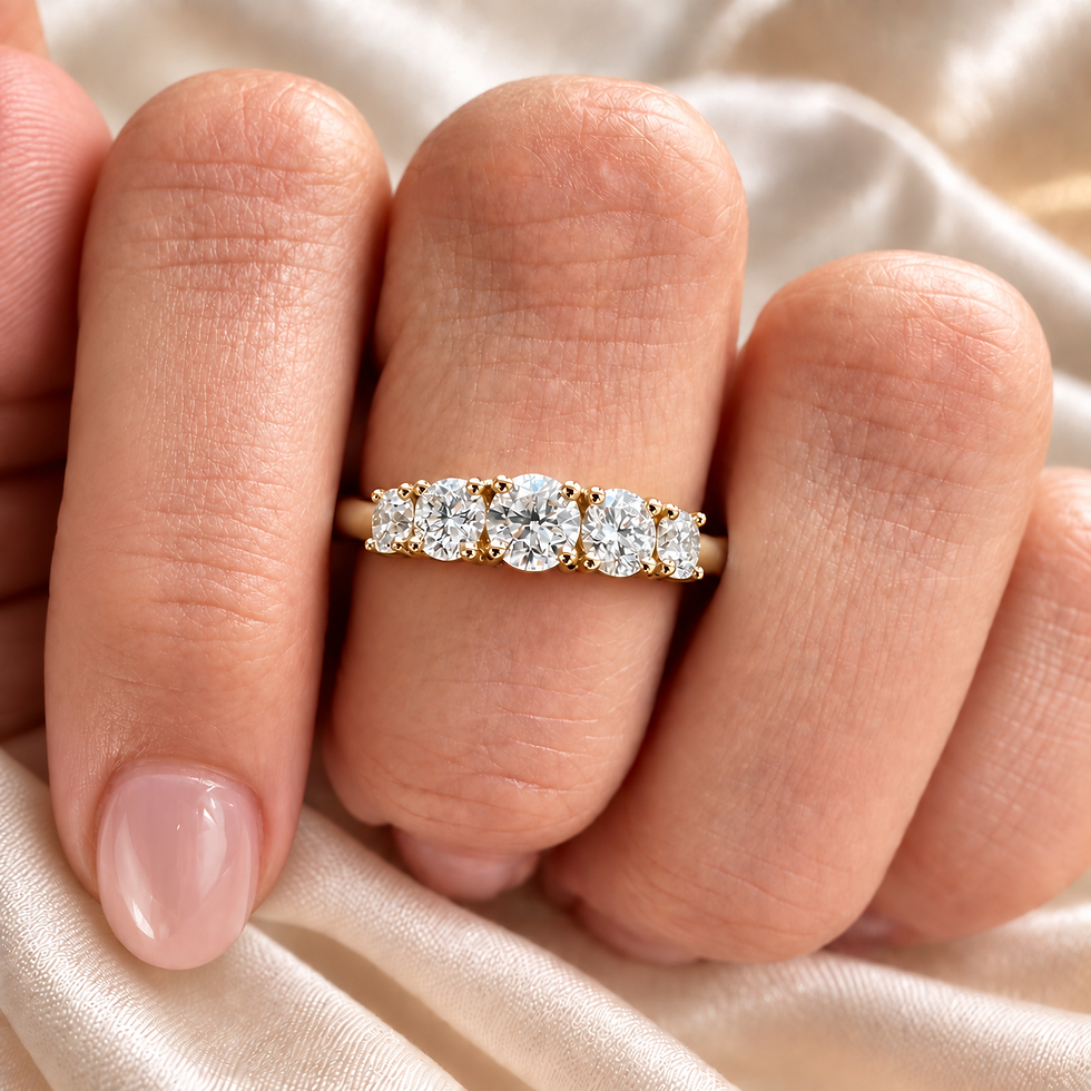 Yellow gold graduated diamond band worn on the hand