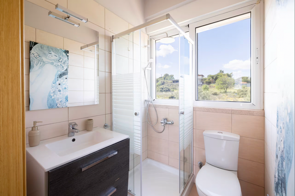 En suite bathroom with walk-in shower at Villa Abelos Christina