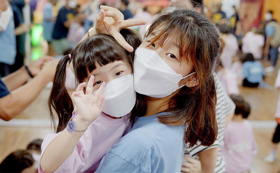 Older youth caring for a younger child during a YANA program.