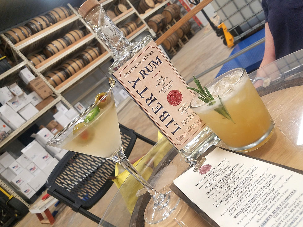 photo of cocktails on table inside warehouse distillery