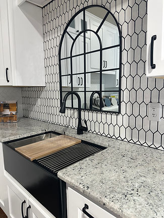 sink, mirror, cabinets, marble countertop 