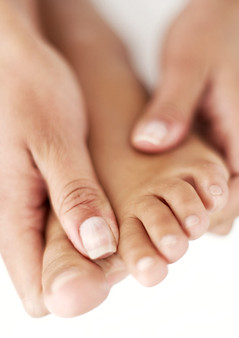 Hands holding foot