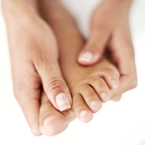 pedicured foot being massaged